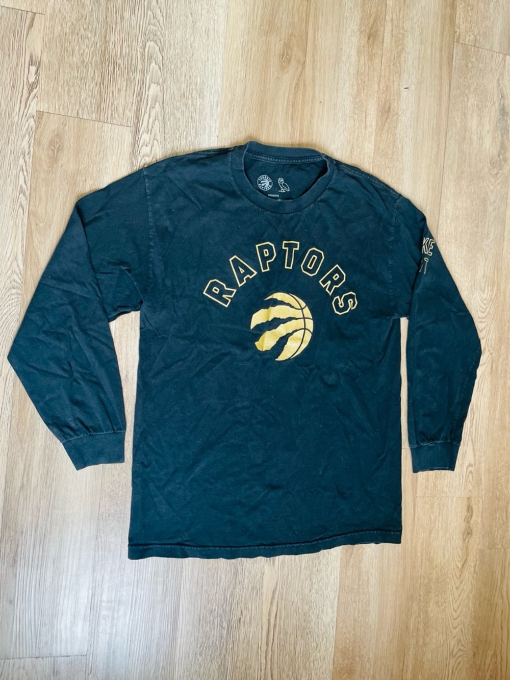 Toronto Raptors xOVO Drake’s Night Black Long Sleeve Tee with Gold Logo